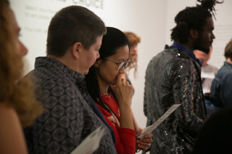 Visitors read leaflets about rebel exhibit at the NPG. Photo by Kristian Buus